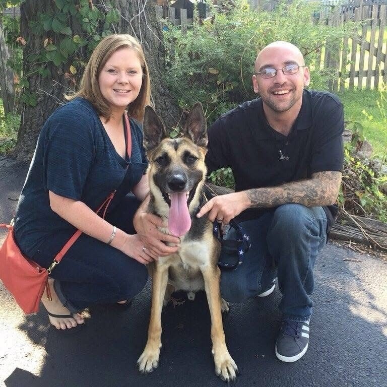 guy and lady with German shepherd